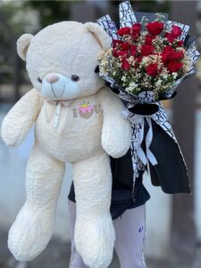 “Soft expressions of care and affection, this teddy bear paired with a beautifully arranged flower bouquet creates a perfect balance of warmth and elegance. Together, they symbolize love, comfort, and thoughtful gifting, making them an ideal choice for expressing heartfelt emotions on any special occasion.”